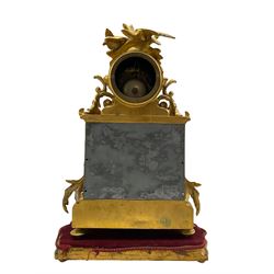 French Napoleon III mantle clock in a gilt speller rococo case surmounted by two birds taking flight, with six Sevres style hand painted porcelain panels, side panels painted with garlands of flowers and a full length depiction of a dancing female with a tambourine to the centre, corresponding dial with Roman numerals and gilt spade hands, with an eight-day rack striking movement striking the hours and half hours on a bell, movement backplate stamped “C&S”, case stamped “P.H. Morey”, on a gilded velvet covered plinth. With pendulum & key