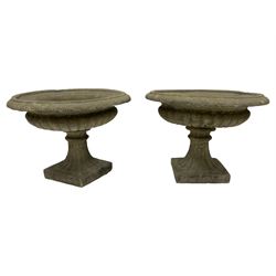 Pair of Victorian design squat garden urns, egg and dart border over narrow neck and gadrooned underbelly, turned and fluted stem on square foot
