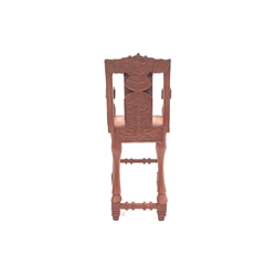  20th century Indo-Persian design carved and painted hardwood high chair, ram head arm terminals, panel seat, floral caved frieze, raised on square moulded front supports and turned rear supports in the form of rams legs, W50cm, H105cm, D50cm  