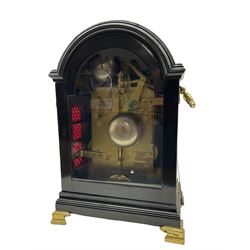 Early 19th century ebonised bracket clock by Desbois & Wheeler of Gray's Inn Passage, London, in a pad topped break arch case with a full-length door with silk backed fretted spandrels, case on a moulded plinth raised on four bracket feet, cast brass handles and sound frets to the sides, with an enclosed circular convex enamel dial with Roman numerals, minute markers and finely pierced steel moon hands, corresponding enamel pendulum adjustment dial graduated in five minute increments, three train fusee movement with a  recoil anchor escapement chiming the quarters on eight-bells and hours on one, with pull repeat and pendulum lock, dial and movement backplate inscribed Desbois & Wheeler. With pendulum, winding key and two case keys