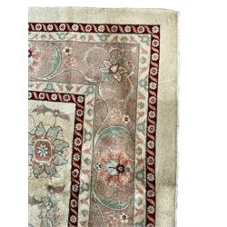 Persian Heriz pale camel ground rug, the central coral pole medallion enclosing palmettes, the field decorated with extending foliate patterns, the border guarded by crimson bands and filled with repeating stylised plant motifs