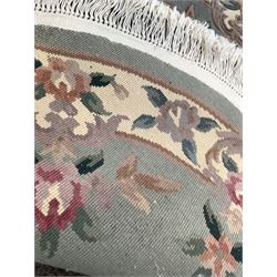Chinese washed wool blue ground rug with floral decoration (180cm x 92cm) together with a matching circular rug (D148cm)