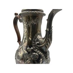 George III silver coffee pot with later embossed decoration of flowers and leaves, stained handle and gadrooned foot H28cm London 1770 Maker Charles Wright