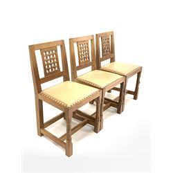 Peter 'Rabbitman' Heap of Wetwang - Yorkshire oak set of eight (6+2) dining chairs, carved lattice backs and studded leather upholstered seats, raised on octagonal supports, carved with rabbit signature (W53cm)