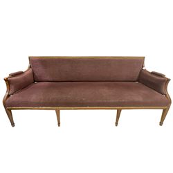 Regency period walnut framed three seat settee, the cresting rail painted with ebonised guilloche decoration, upholstered in textured mauve fabric with sprung seat, raised on square tapering supports with spade feet