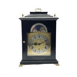 20th century Kieninger bracket clock in an 18th century ebonised styled case, with a three-train spring driven pendulum movement striking the hours and chiming the quarters on a nest of 9 bells, with Westminster, Whittington and St Michael chime selection, silent, night silent and strike operation, with a break arch brass dial, silvered chapter ring, seconds dial and working moon phase disc. With pendulum and key.  