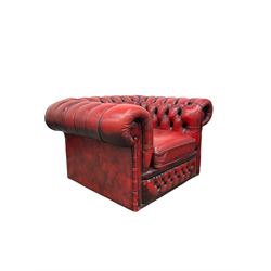 Red chesterfield armchair, buttoned back and arms with one squab cushion, raised on brass castors