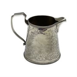 Victorian silver milk jug of oval design engraved with trailing foliage, vacant cartouche and angular handle H12cm London 1883 Maker Holland, Son and Slater 7.6oz