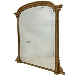 Victorian gilt framed over-mantle mirror, arch top with spiral pilasters, bevelled plate