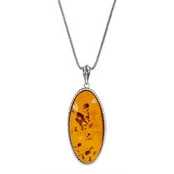 Silver Baltic amber oval pendant necklace, stamped 925 