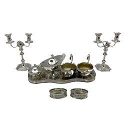 Pair of late Victorian Elkington & Co silver-plated candelabra, each with two branches on shaped bases H28cm, pair of silver-plated sauce boats, pair of pierced bottle coasters, Georgian style navette shaped sauce tureen, galleried tray etc (8)