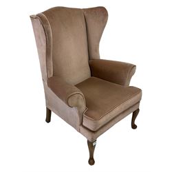 Parker Knoll - wingback armchair upholstered in light pink fabric, raised on cabriole supports