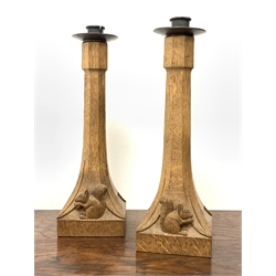 Pair 'Squirrelman' Yorkshire oak candlesticks of tapered octagonal form with square bases and caved with squirrel signature, H32cm
