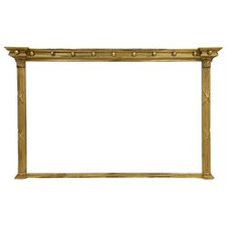 Regency style giltwood overmantel mirror, moulded projecting cornice with applied ball decoration, bevelled mirror plate flanked by fluted columns with Corinthian capitals 