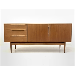McIntosh & Co Ltd - Mid 20th century teak sideboard, fitted with double cupboard enclosing shelves, flanked by three graduated drawers, raised on tapering supports 