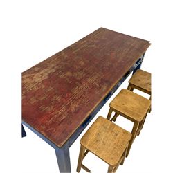 Early to mid 20th century hardwood school laboratory table, the flat projecting top over two long drawers, raised on block supports, together with set six oak laboratory stools with square supports