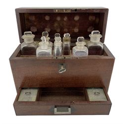 Victorian mahogany campaign or travelling apothecary box, with hinged lid having inset brass handle, the fitted interior includes eight clear glass bottles & stoppers, a single drawer fitted below with inset brass handle and two  lidded boxes, H19cm, W24cm, D9cm