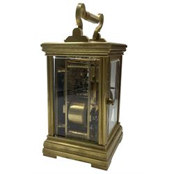 Late 19th century French  8-day striking carriage clock with a rack strike repeat on a gong - in an anglaise brass case with an oval escapement viewing glass and  bow shaped carrying handle to the top of the case, enamel dial with Roman numerals, minute markers and steel spade hands, two train going barrel movement with a replacement platform lever escapement and original matching leather carrying case with strap. Original double key.