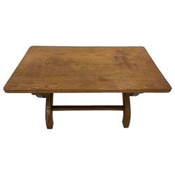 Rabbitman - oak coffee table, rectangular adzed top on curved x-framed supports, carved with rabbit signature, by Peter Heap, Wetwang