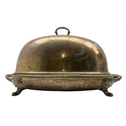 Late Victorian large plated oval heated meat tray with gadrooned edge, gravy well and cast leaf handles L67cm and a similar meat dome engraved with a crest