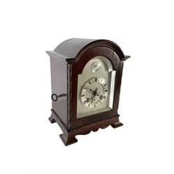 French - Small mahogany cased 8-day mantle clock c1905, with a break arch pediment and conforming fully glazed door with a silvered slip, on a shaped base with bracket feet, silvered sheet dial and chapter ring with engraved Roman numerals, minute hands and steel gothic hands, Parisian rack striking movement with a lever platform escapement, striking the hours and half hours on a coiled gong. with key.