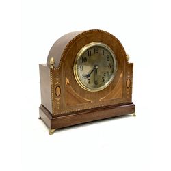 Edwardian mahogany dome top mantel clock, the case with gilt metal acorn finials, boxwood string, chequered and floral inlay, the silvered dial with Arabic chapter ring, with eight day movement striking the hours and halves hammer on bell W32cm