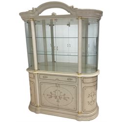 Italian composite marble display cabinet, arched pediment with mirror flanked by cartouche and scrolling, fitted with glass upper section with two shelves, central glazed double doors flanked by column uprights with gilt capitals, rounded doors to each side above central single drawer and cupboards with shaped ends, raised on shaped plinth base