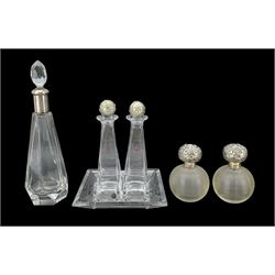 Pair of Edwardian globular ribbed glass scent bottles with silver stoppers, London, 1904, makers marks rubbed, H12cm, Art Deco silver mounted faceted glass bottle, Paris hallmarks, H28cm, Italian decanter set on stand by Ottaviani, comprising two square section decanter with silver flower moulded stoppers, two square dishes and stand 