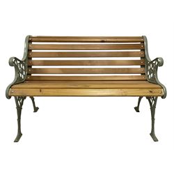 Garden bench, the slatted seat and back with green painted iron ends 
