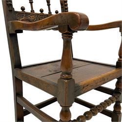 17th century design oak armchair, the back carved with trailing foliage and with turned spindle supports, the uprights mounted with split turnings and with scrolled terminals, panelled plank seat, on turned supports joined by bobbin turned and plain stretchers