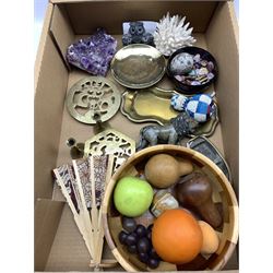 Carved stone model of a Lion, turned wooden fruit, quartz specimen, brass trivets and miscellanea in one box