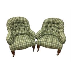 Pair late 19th century walnut framed armchairs, upholstered in deep buttoned green tartan fabric with sprung seat, the apron lined with studwork, raised on heavily turned supports with brass cups and castors