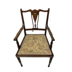  Late Victorian mahogany part drawing room suite, comprising one carver chair, four standard chairs and one low chair, the shaped cresting rail over splat, decorated with inlaid urns, upholstered in floral fabric, raised on turned supports 