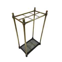 Victorian brass stick stand of six divisions with drip tray 