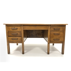 Mid 20th century oak twin pedestal desk, with one long drawer flanked by slides and five short drawers, raised on square supports, drawer locks stamped Burndale office furnishers, 152cm x 83cm, H77cm