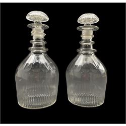 Pair of Regency glass triple ring neck decanters with fluted decoration and compressed mushroom stoppers H24cm