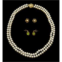 Double strand cultured pearl necklace, with gold clasp stamped 14K, pair of gold peridot pendant stud earrings and a pair of gold pearl stud earrings, both 9ct