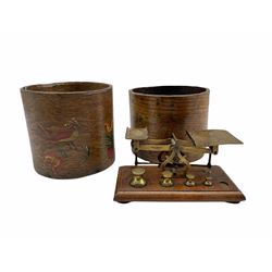 Half gallon wooden grain measure with painted decoration, another and a set of brass postal scales by J & J Smith London with four weights on wooden base 