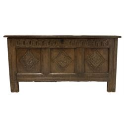 18th century carved oak blanket chest, the three panelled lifting lid over base with carved diamond panels, raised on stile supports 