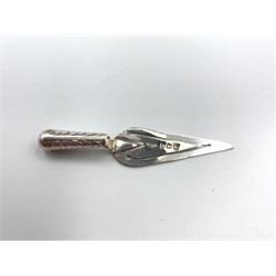 Edwardian silver trowel shape bookmark Birmingham 1904 by Crisford & Norris, another by the same maker 1909, a small trowel Birmingham 1908 by W H Leather and two sword shape bookmarks by Adie & Lovekin, one with amber glass pommel (5) 