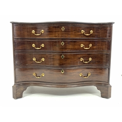  Georgian design mahogany serpentine front chest of four graduating drawers enclosed by canted fluted corners, the top drawer fitted with baize covered slide revealing storage compartments, raised on bracket feet with recessed castors, W106cm, H82cm, D61cm  