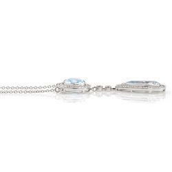 18ct white gold milgrain set pear and cushion cut blue topaz and round brilliant cut diamond pendant, on trace link necklace, total topaz weight approx 5.50 carat, total diamond weight approx 0.60 carat