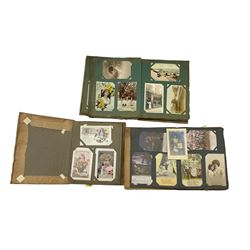 Post card album and contents including World War I Bamforth Songs cards, greeting cards etc and two other albums of vintage cards (3)