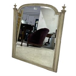 Distressed painted wall mirror, stepped arched moulded frame with lobe carved finials, bevelled mirror plate