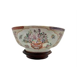 18th century Chinese Export punch bowl decorated with reserves of flowers on a textured ground, with geometric and diaper borders, on hardwood stand, D26.5cm 

