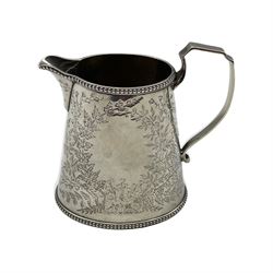Victorian silver milk jug of oval design engraved with trailing foliage, vacant cartouche and angular handle H12cm London 1883 Maker Holland, Son and Slater 7.6oz