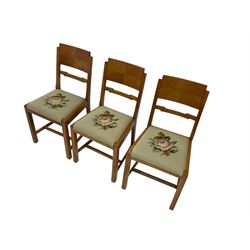 Art Deco walnut extending dining table, rectangular top with canted corners, raised on chamfered supports (W153cm D92cm H77cm); and set six matching walnut chairs, geometric shaped back rail, drop in seat upholstered in floral tapestry fabric (W46cm D52cm H90cm)