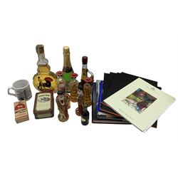 Bottle of Spanish brandy in guitar shape bottle 45cl, five smaller bottles as matadors and Spanish ladies. two miniature bottles of Southern Comfort in presentation tin, bottle of Sangria 200cc, miniature of Blandy's Madeira etc (11) and various Cunard menus Concorde book etc