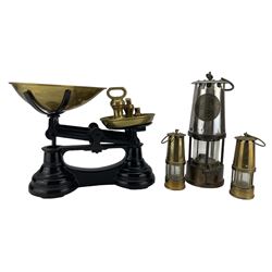 Miners safety lamp by Protector Lamp and Lighting Co., Eccles, pair of miniature brass miners lamps and a set of kitchen scales with seven brass bell weights