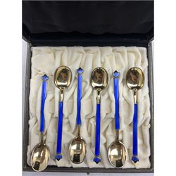Set of six Norwegian silver gilt and blue enamel coffee spoons with leaf shape finials by David Andersen in case and a pair of David Andersen silver sugar tongs